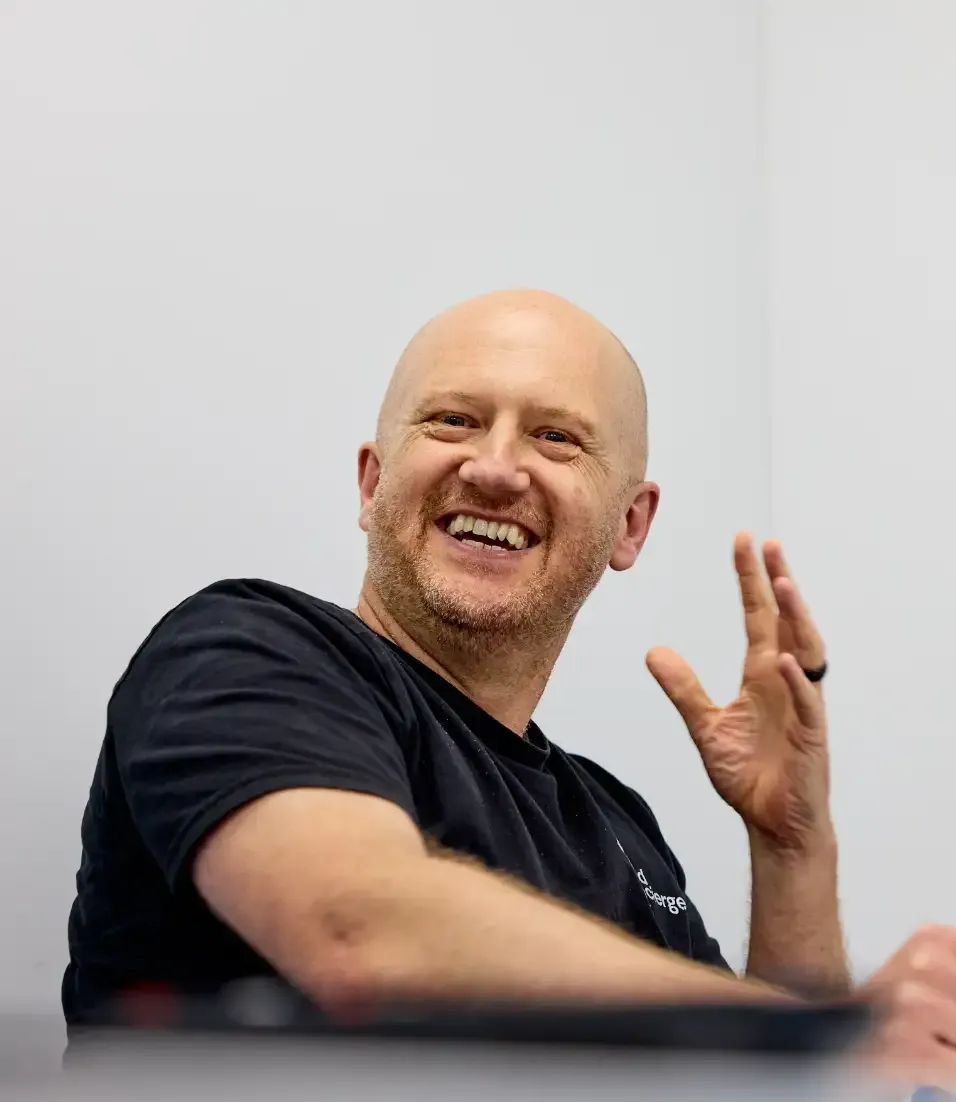 A colleague at Build Concierge gesturing with his hands